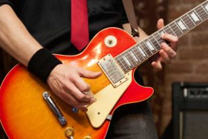 play guitar like a pro - musician with electric guitar